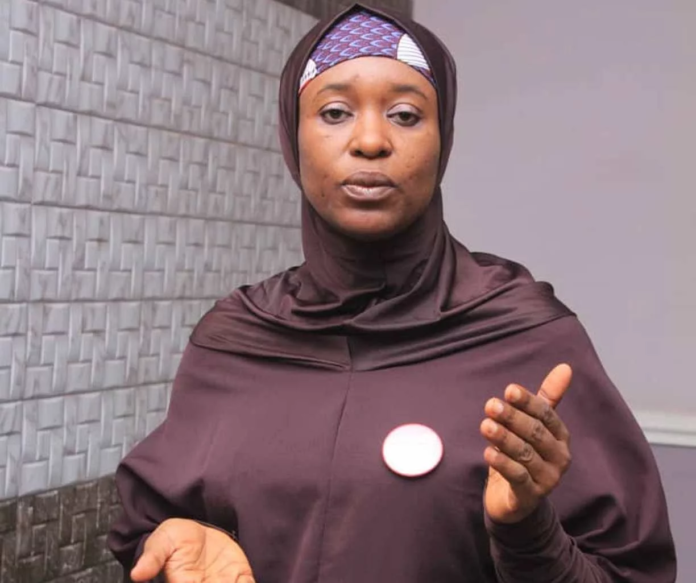 Aisha Yesufu image of a woman in brown dress and head covering