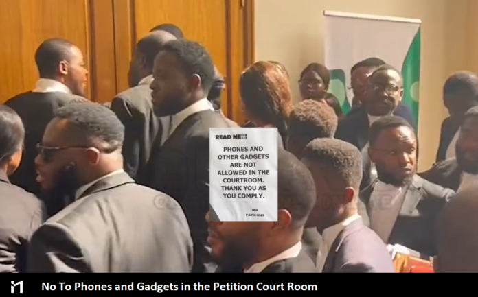 Presidential Election Petition Court bans phones, gadgets from May 22. A notice was placed at the entrance to the Presidential Election Petition Court room.